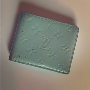 Louis Vuitton used teal wallet .